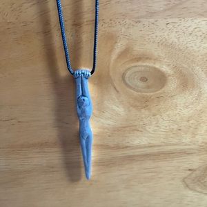 CARROL BOYES - pewter necklace on black cord.